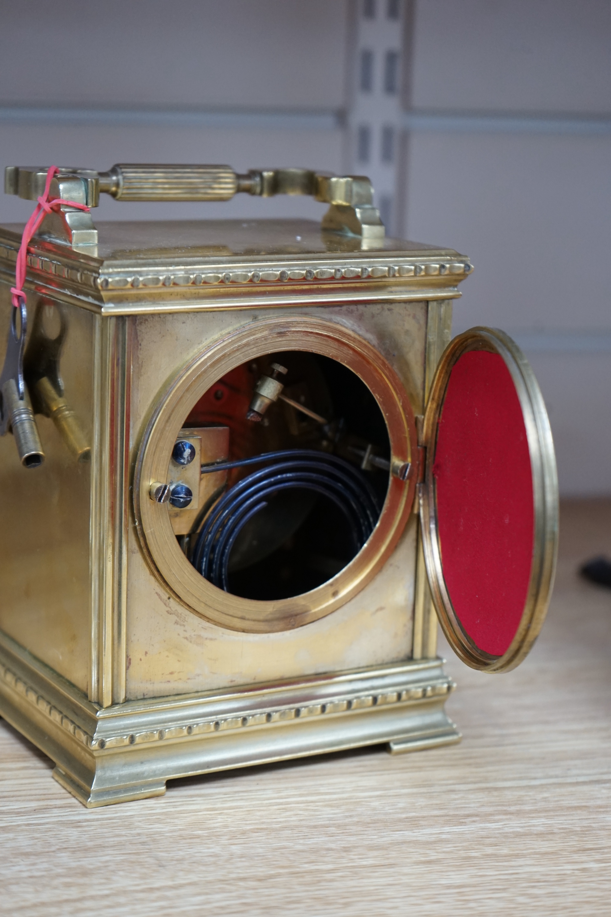 A late 19th century French brass large carriage clock with convex enamel dial, retailed by Robinson & Co. with key, 17cm. Condition - fair to good, not tested as working